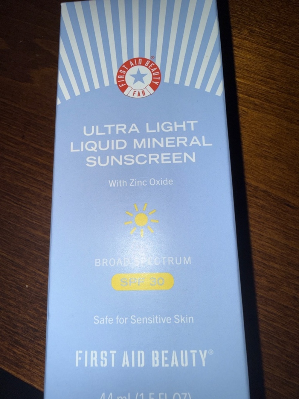 First Aid Beauty Ultra Light Liquid Mineral Sunscreen in Light Blue